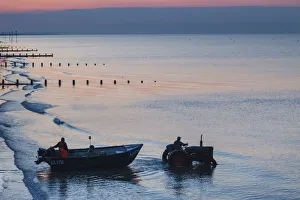 England, West Sussex, Bognor Regis, Fishermen Departing at Dawn