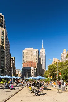 Flat Iron Prints: Enjoying the sun in the Flatiron Plaza, New York, USA