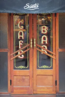 Buenos Aires Prints: The entrance door of the Notable Bar Saeta Cafe in Fileteado Art