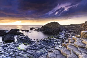 Images Dated 29th April 2020: An epic sunset at the Giants Causeway with its iconic basalt columns