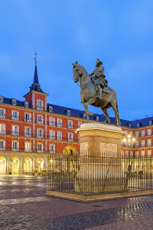 Historical Landmark Prints: Equestrian statue of Phillip III and Casa de la Panaderia at Plaza Mayor at twilight