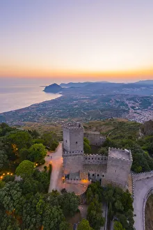 Erice, Sicily. Aerial of the Norman castle at sunrise, view towards Monte Cofano