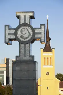 Freedom Square Prints: Estonia, Tallinn, Cross In Freedom Square With St Johns Church (Jaani Kirik)