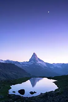 Ethereal lights of dusk over Matterhorn mirrored in Stellisee lake, Zermatt, Canton of Valais, Switzerland