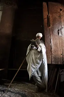 Ethiopia Prints: Ethiopia, Lalibela. A priest in one of the ancient rock-hewn churches of Lalibela