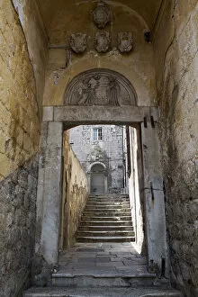 Images Dated 28th August 2015: Europe, Croatia, Dalmatia, Dubrovnik, a gate and stone stairway in the historic centre