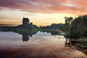 Europe, Dublin, Ireland, Dunguaire castle in Kinvara village at sunrise reflecting