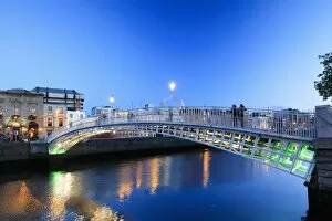 Images Dated 17th July 2017: Europe, Dublin, Ireland, Halfpenny bridge by night reflecting on the Liffey river