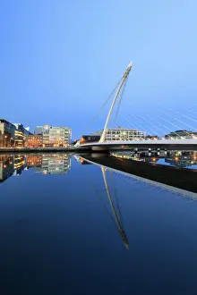 Liffey River Prints: Europe, Dublin, Ireland, Samuel Beckett bridge by night reflecting on the Liffey river