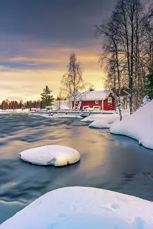 Images Dated 24th February 2023: Europe, Finland, red house by the river near Ruka