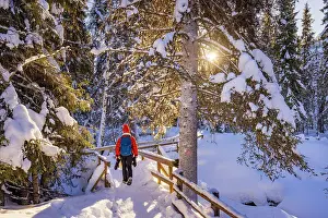 Freeze Prints: Europe, Finland, a tourist wearing red clothes visiting Korouoma canyon MR