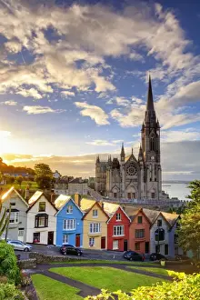 Europe, Ireland, Cork, Cobh Cathedral at colored houses at sunrise