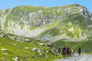 Trail Prints: europe, Italy, the Abruzzi. Riders on a road in the National Park of Gran Sasso