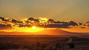 Vulture Prints: Europe, Italy, Apulia. Sunset in the Alta Murgia Nationalpark with view towards the Vulture Mountain