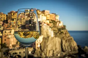 Cinque Terre Prints: europe, Italy, cinque Terre. view of the village of Manarola with a reflection in