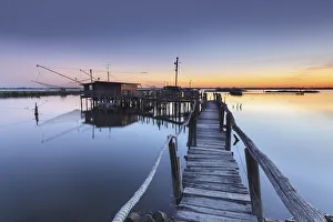 Adriatic Sea Gallery: Europe, Italy, Emilia Romagna, Ferrara. Fishing huts on stilts in the valleys of Comacchio