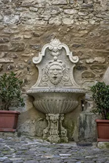 Europe, Italy, Liguria. Dolceacqua. Fountain in the town