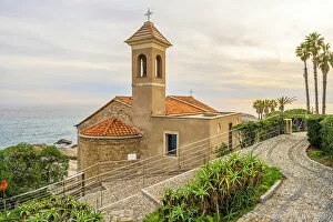 Images Dated 3rd February 2023: Europe, Italy, Liguria. The little church of Sant'Ampelio in Bordighera at sunset