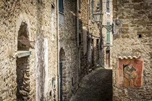 Europe, Italy, Liguria. A narrow street in Apricale