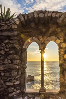 Europe, Italy, Liguria, Portovenere. Sunset seen through the old ruins