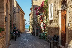 europe, Italy, The Marches. A narrow street in the beautiful hamlet of Torre di Palme near Fermo, with sea view