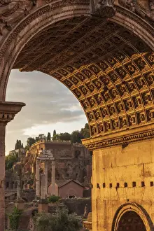 Europe, Italy, Rome. The arch of Septimus Severus in the Forum Romanum at sunrise