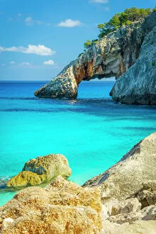 Images Dated 10th November 2022: Europe, Italy, Sardinia. Cala Goloritze, the beach and the arch