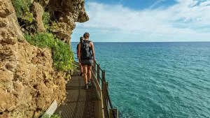 Images Dated 10th November 2022: Europe, Italy, Sardinia. People hiking on the path to the Grotta del Bue Marino near to Cala Luna