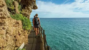 Trekking Prints: Europe, Italy, Sardinia. People hiking on the path to the Grotta del Bue Marino near to Cala Luna
