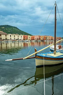 Sailing Collection: Europe, Italy, Sardinia. A traditional sailingboat anchoring on the banks of River Temo in Bosa