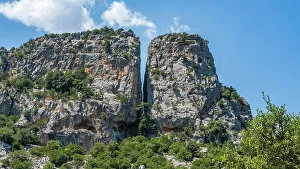 Images Dated 8th September 2022: Europe, Italy, Sardinia. View to a crevice from the hiking trail to Tiscali archeological village