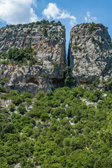 Images Dated 8th September 2022: Europe, Italy, Sardinia. View to a crevice from the hiking trail to Tiscali archeological village