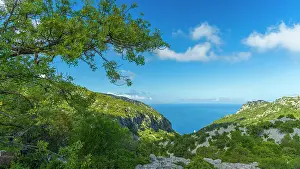Footpath Prints: Europe, Italy, Sardinia. View from the footpath towards the rock formations of Cala Goloritze