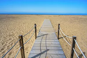 Images Dated 16th March 2023: Europe, Italy, Sardinia. A wooden gangway to the long sandy beach of Piscinas
