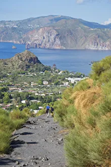 Europe, Italy, Sicily, Aeolian Islands, Vulcano Island, People hiking down Gran Cratere