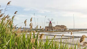 europe, Italy, Sicily, Marsala, Trapani. the salt flats with the ancient wind mill