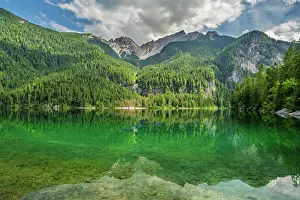 Europe, Italy, Trentino. The lake tovel and the Brenta Dolomites reflecting in its waters