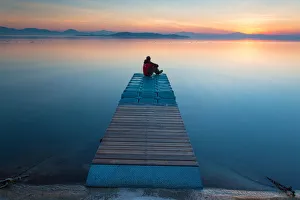 Europe, Italy, Umbria, Perugia district. Jetty Lake Trasimeno at sunset