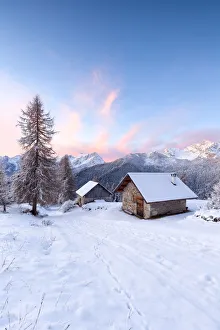 Zoldo Prints: Europe, Italy, Veneto, Belluno, Dolomites. Mountain chalets in a colorful winter sunrise