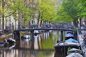 Images Dated 25th November 2013: Europe, Netherlands, Holland, Amsterdam, canal boats on the canal and bicycles