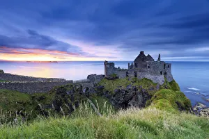 Europe, Northern Ireland, Dunluce Castle at sunset