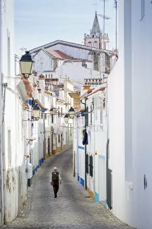 Images Dated 23rd September 2015: Europe, Portugal, Alentejo, Arronches, an old man walking along a cobbled street in