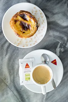 Images Dated 23rd September 2015: Europe, Portugal, Alentejo, Beja, Portuguese custard tart (pastel de nata) and coffee