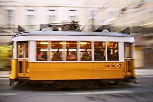 Europe, Portugal, Lisbon, a speeding tram (streetcar) in the city center