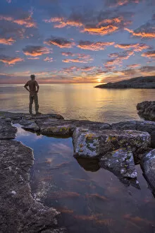 Images Dated 15th September 2016: Europe, United Kingdom, Scotland, man on coast near Lochinver at sunset (MR) (m)