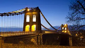 Evening illuminations on the Menai Suspension Bridge spanning the Menai Strait, Bangor