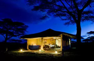 Evening image of dining tent, safari camp, Tanzania