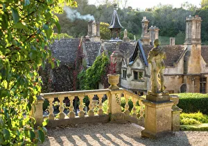 Evening light on The Manor House, 14th century building set in 365 acres of secluded parkland in the Cotswold village Castle Combe, Wiltshire, Cotswolds, England