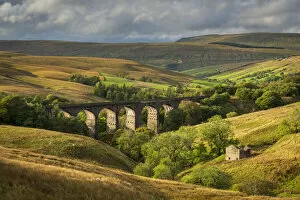 Evening sunlight illuminates Dent Head Viaduct in the Yorkshire Dales National Park