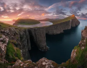 Faroese Prints: An explosive sunset during a summer evening at the lake above the ocean (Sorvagsvatn)